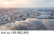 Beautiful panorama View of the Dnieper river, church of St. Nicholas on the water, River station, Havana bridge and Naberezhno-Kreschatitska street on the sunset in Kiev, Ukraine. Drone photo. Aerial top view of Dnepr river and Podol district from above, Kiev (Kyiv) city, Ukraine. Стоковое фото, агентство Ingram Publishing / Фотобанк Лори