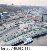 Panoramic view of St. Andrew’s Church on the Andreev Mountain , the Ministry of the Interior and the Postal Square with St. Elijah Church in Kiev, Ukraine. Photo by drone. River port and Postal Square with St. Elijah Church , tourist boats on a river Dnepr in Kiev, Ukraine. Стоковое фото, агентство Ingram Publishing / Фотобанк Лори