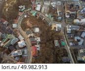 Aerial panoramic view from the drone, bird’s eye view to the Andreevsky descent with old historical buildings at beautiful sunset in the summer.. A bird’s eye view, aerial view shooting from drone of the Podol district, oldest historical center of Kiev, Ukraine. Стоковое фото, агентство Ingram Publishing / Фотобанк Лори
