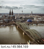 View of the Cologne Cathedral and Hohenzollern Bridge, looking from Koln Triangle tower, Cologne, Germany. View from above. View of the Cologne Cathedral and Hohenzollern Bridge, looking from Koln Triangle tower, Стоковое фото, агентство Ingram Publishing / Фотобанк Лори