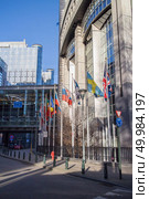 European Parliament towers and European flags in Brussels, Belgium.. European Parliament offices. Стоковое фото, агентство Ingram Publishing / Фотобанк Лори