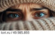 Cozy Winter Concept: Close-up Portrait of Green Eyes Framed by Beige Knitwear, evoking a sense of warm concealment. Стоковое AI-изображение, AI-художник Данила Большаков / Фотобанк Лори