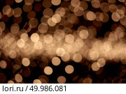 abstract golden background of christmas lights. bokeh background. golden christmas lights background. Стоковое фото, агентство Ingram Publishing / Фотобанк Лори