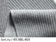 Closeup macro texture of knitted cotton waffle fabric, clothing background with wrinkles and folds. Closeup macro texture of knitted cotton waffle fabric. Стоковое фото, агентство Ingram Publishing / Фотобанк Лори