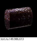 Sideways chocolate candy on a black background. chocolate candy on black background. Стоковое фото, агентство Ingram Publishing / Фотобанк Лори