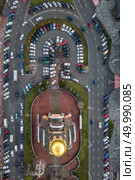 view from a birdseye to the city of Kiev, a parking with lots of cars and a small church with a golden dome. Aerial view of the city of Kiev. Стоковое фото, агентство Ingram Publishing / Фотобанк Лори