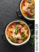 Italian minestrone soup with beef meatballs, vegetables and pasta in bowl. Italian minestrone soup with beef meatballs, vegetables and pasta. Стоковое фото, агентство Ingram Publishing / Фотобанк Лори