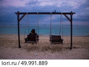 beach view at noon with swing chair photo. beach view at noon with swing chair. Стоковое фото, агентство Ingram Publishing / Фотобанк Лори