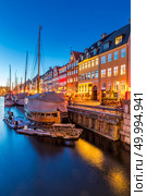 Copenhagen Nyhavn, New port of Copenhagen, at night in Denmark. Стоковое фото, агентство Ingram Publishing / Фотобанк Лори