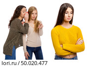 Teenagers making gossip from other girl. Стоковое фото, агентство Ingram Publishing / Фотобанк Лори