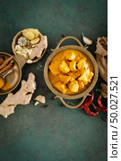 Chicken masala curry, spicy meat. Yellow chicken curry sauce. Spicy chicken curry dish. Traditional indian food, asian cuisine. Top view. Стоковое фото, агентство Ingram Publishing / Фотобанк Лори