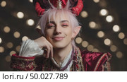 Young man with devil horns and elf ears posing for fantasy video. Стоковое AI-видео, аниматор Юрий Поздников / Фотобанк Лори