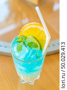 iced lime blue soda with dragon fruit cocktail and mocktail on glass table. Стоковое фото, агентство Ingram Publishing / Фотобанк Лори