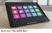 Digital tablet displaying health-related app icons on table. Стоковое AI-видео, аниматор KATERINA AI / Фотобанк Лори
