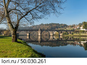 Bridge of Ponte da Barca, ancient portuguese village, on Minho river, north of Portugal. Стоковое фото, агентство Ingram Publishing / Фотобанк Лори