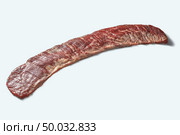 Bavette steak or flank steak on a white background. Fresh raw organic veal meat on a white with place for text.. Raw beef bavette steak fore roasting isolated on a white background, copy space. Стоковое фото, агентство Ingram Publishing / Фотобанк Лори