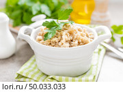 Barley porridge on white background. Стоковое фото, агентство Ingram Publishing / Фотобанк Лори