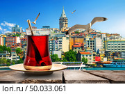 Tea and Galata Tower in Golden Horn bay, Turkey. Стоковое фото, агентство Ingram Publishing / Фотобанк Лори
