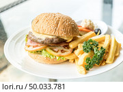 Beef hamburger with fires and fresh vegetable. Стоковое фото, агентство Ingram Publishing / Фотобанк Лори