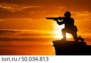 Silhouette of soldier on the edge. Element of design. Стоковое фото, агентство Ingram Publishing / Фотобанк Лори