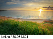 Sundown composition. Sky, sea, and green grass. Стоковое фото, агентство Ingram Publishing / Фотобанк Лори
