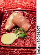 Arranged small ball : Deep fried  European pear tempura with Prosciutto parma ham. Стоковое фото, агентство Ingram Publishing / Фотобанк Лори