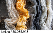 Detailed view of a section of cloth showcasing intricate weave patterns and textures in extreme close-up. Стоковое AI-изображение, AI-художник Данила Большаков / Фотобанк Лори
