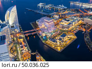 Aerial view of panoramic modern city in Yokohama City Japan with blue hour after sunset in th evening. Yokohama is the second largest city in Japan by population. Стоковое фото, агентство Ingram Publishing / Фотобанк Лори