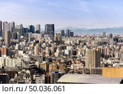 aerial view of Tokyo skylines and skyscrapers buildings in Shinjuku ward in Tokyo. Taken from Tokyo Bunkyo civic center observatory sky desk. . Стоковое фото, агентство Ingram Publishing / Фотобанк Лори