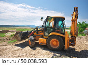 Excavator workimg on the ground. Building design. Стоковое фото, агентство Ingram Publishing / Фотобанк Лори