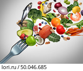 Eating healthy food and eat clean symbol as fresh raw ingredients bursting out of a dinner fork with 3D illustration elements. Стоковое фото, агентство Ingram Publishing / Фотобанк Лори