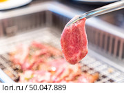 grilled japanese wagyu premium beef yakiniku with red hot charcoal. Стоковое фото, агентство Ingram Publishing / Фотобанк Лори