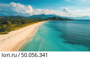 A beautiful beach with a clear blue ocean in the background. Стоковое AI-изображение, AI-художник Ярославский Максим / Фотобанк Лори