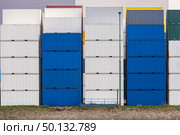 Cargo Containers Goods Stack at the Pier docks port waiting for international sea freight transportation in Rotterdam Port of Netherlands. Стоковое фото, агентство Ingram Publishing / Фотобанк Лори