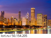 Chicago downtown Cityscape skylines and skyscrapers office building with Lake Michigan sunset in Chicago city Illinois USA. Стоковое фото, агентство Ingram Publishing / Фотобанк Лори