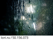 drops on glass , window condensation , and the background for dark text , spray on the window. Стоковое фото, агентство Ingram Publishing / Фотобанк Лори