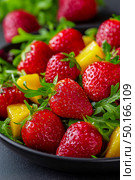 Colorful salad with strawberries and peaches on a bed of mixed greens, beautifully arranged in a white bowl, highlighting fresh ingredients and healthy dining experience. Стоковое AI-изображение, AI-художник Ирина Ручушкина / Фотобанк Лори