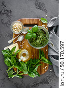 Traditional italian pesto alla genovese with fresh basil leaves, pine nuts, olive oil, garlic and parmesan cheese. Стоковое фото, агентство Ingram Publishing / Фотобанк Лори
