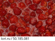 Homemade preparation of strawberry jam. Foam and juice when cooking strawberries. The process of making strawberry jam. Close-up of boiling strawberries. Стоковое фото, фотограф Андрей Жигальцов / Фотобанк Лори