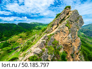 Beautiful view of rocky peak above green mountains. Dagestan, Caucasus. Стоковое фото, фотограф Константин Лабунский / Фотобанк Лори