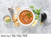 Eggplant hummus with ingredients for cooking. Traditional vegan arabic aubergine appetizer. Baba Ghanoush. Стоковое фото, агентство Ingram Publishing / Фотобанк Лори