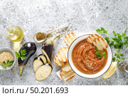 Eggplant hummus with ingredients for cooking. Traditional vegan arabic aubergine appetizer. Baba Ghanoush. Стоковое фото, агентство Ingram Publishing / Фотобанк Лори