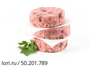 Raw veggie burger with beetroot and white beans with parsley leaves on white background. Стоковое фото, агентство Ingram Publishing / Фотобанк Лори
