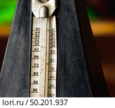 Detail of an old Vintage mechanic musical metronome, unique rusty scale showing the various tempos. Стоковое фото, фотограф Camptoloma / Фотобанк Лори