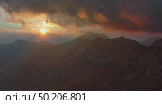 Sunset mountains and dramatic clouds. Стоковое видео, видеограф Михаил Коханчиков / Фотобанк Лори
