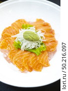 Japanese fresh salmon sashimi or Japanese gourmet and delicacy sashimi with raw sliced fish. Стоковое фото, агентство Ingram Publishing / Фотобанк Лори