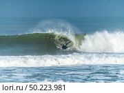 Bodyboarder surfing ocean wave on a sunny day. Стоковое фото, агентство Ingram Publishing / Фотобанк Лори