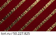 Elegant red and gold textured design on luxury paper with diagonal stripes. Стоковое AI-изображение, AI-художник Katsiaryna Repich / Фотобанк Лори