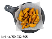 French fries on a black ceramic tray, top view. Isolated on white background. Стоковое фото, агентство Ingram Publishing / Фотобанк Лори