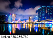 Macau cityscape at night, all hotel and tower are colorful lighten up with blue sky, Macau, China. Стоковое фото, агентство Ingram Publishing / Фотобанк Лори